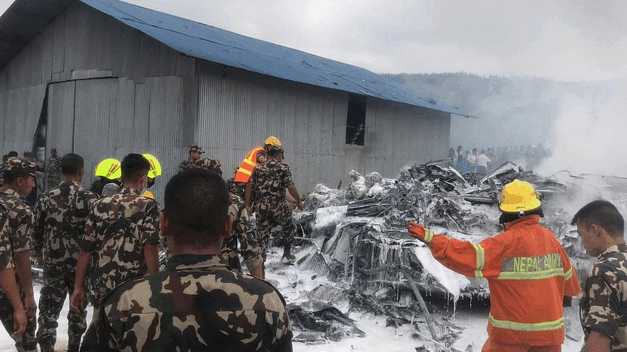 <div class="paragraphs"><p>Scenes from the aircraft crash site in Nepal</p></div>
